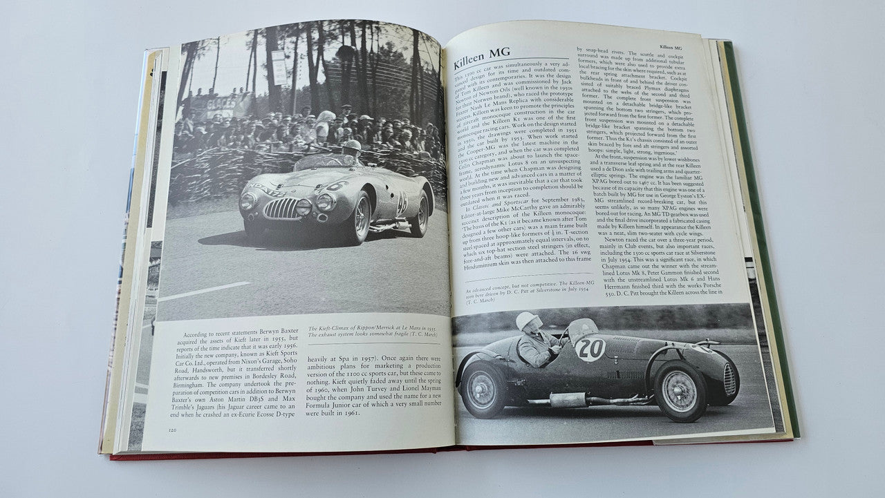 Sports racing book open with black-and-white race car photos on both pages