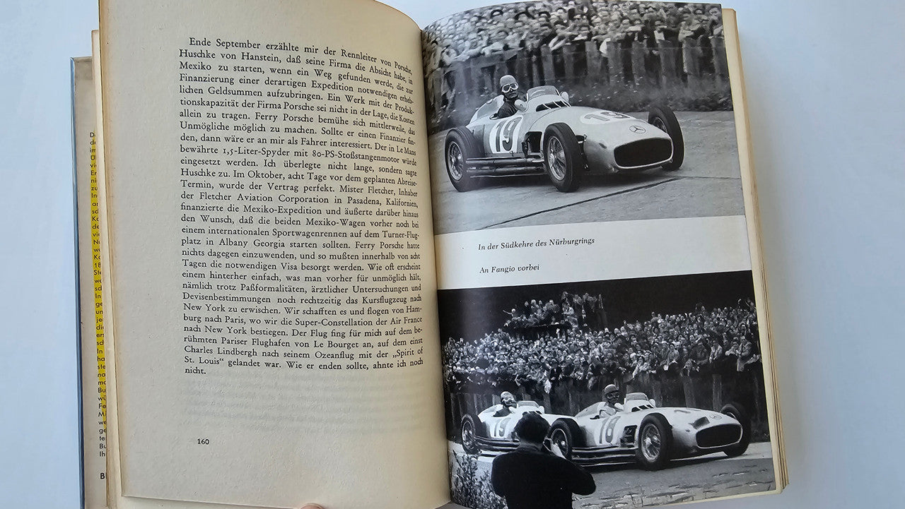 Chasing Victory open book with vintage race car photos and German text
