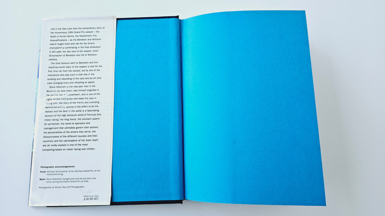 Open book showing blue interior covers and white page block
