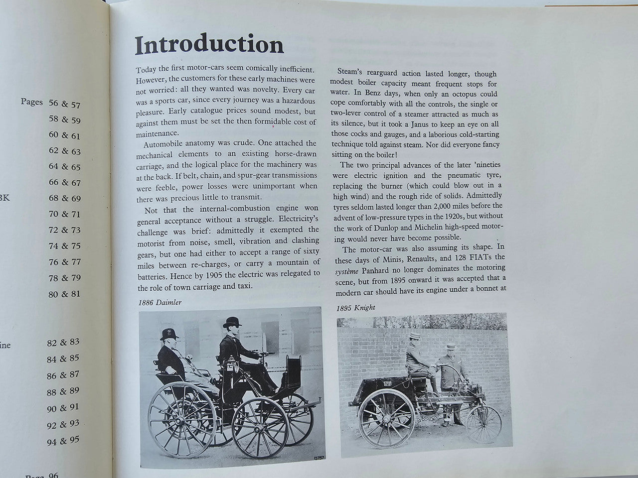 Open vintage automotive history book page with introduction text and carriage illustrations