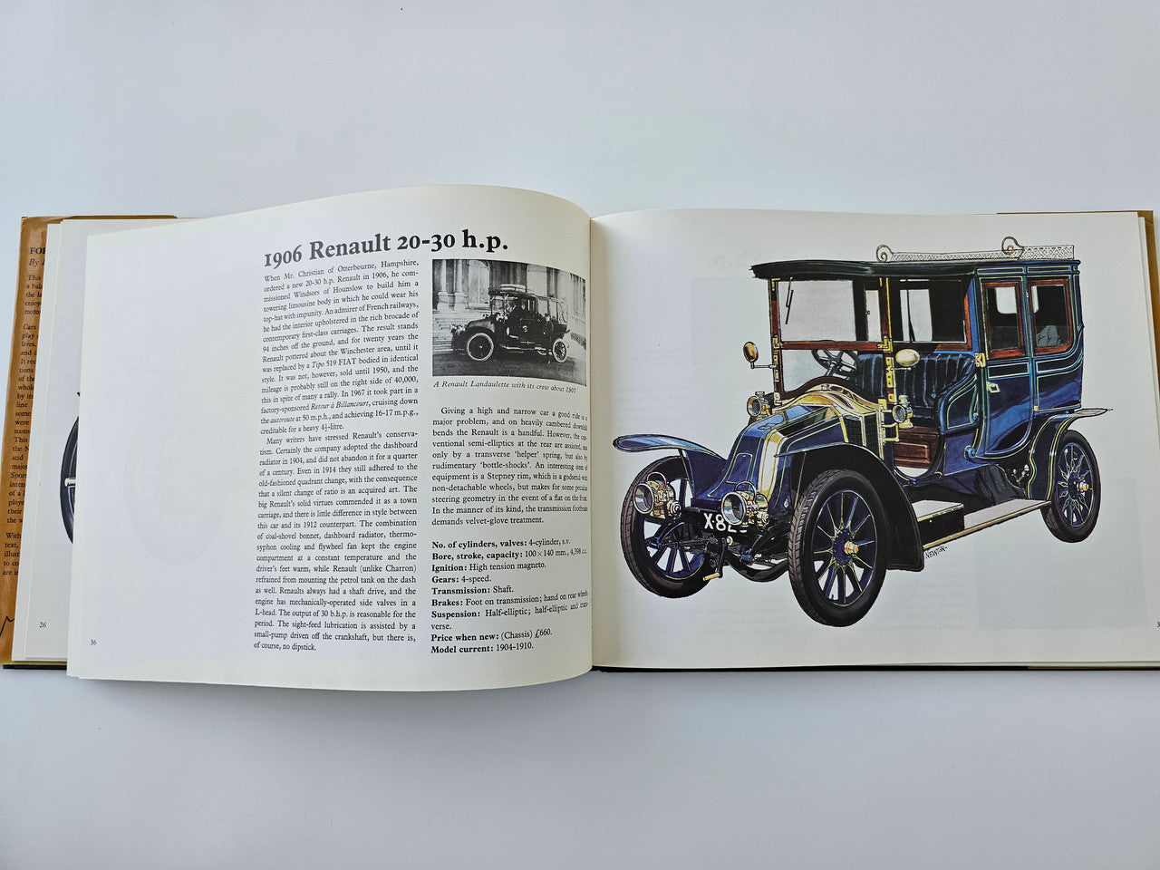 Open vintage automotive history book page with 1906 Renault 20-30 h.p. text and car illustration
