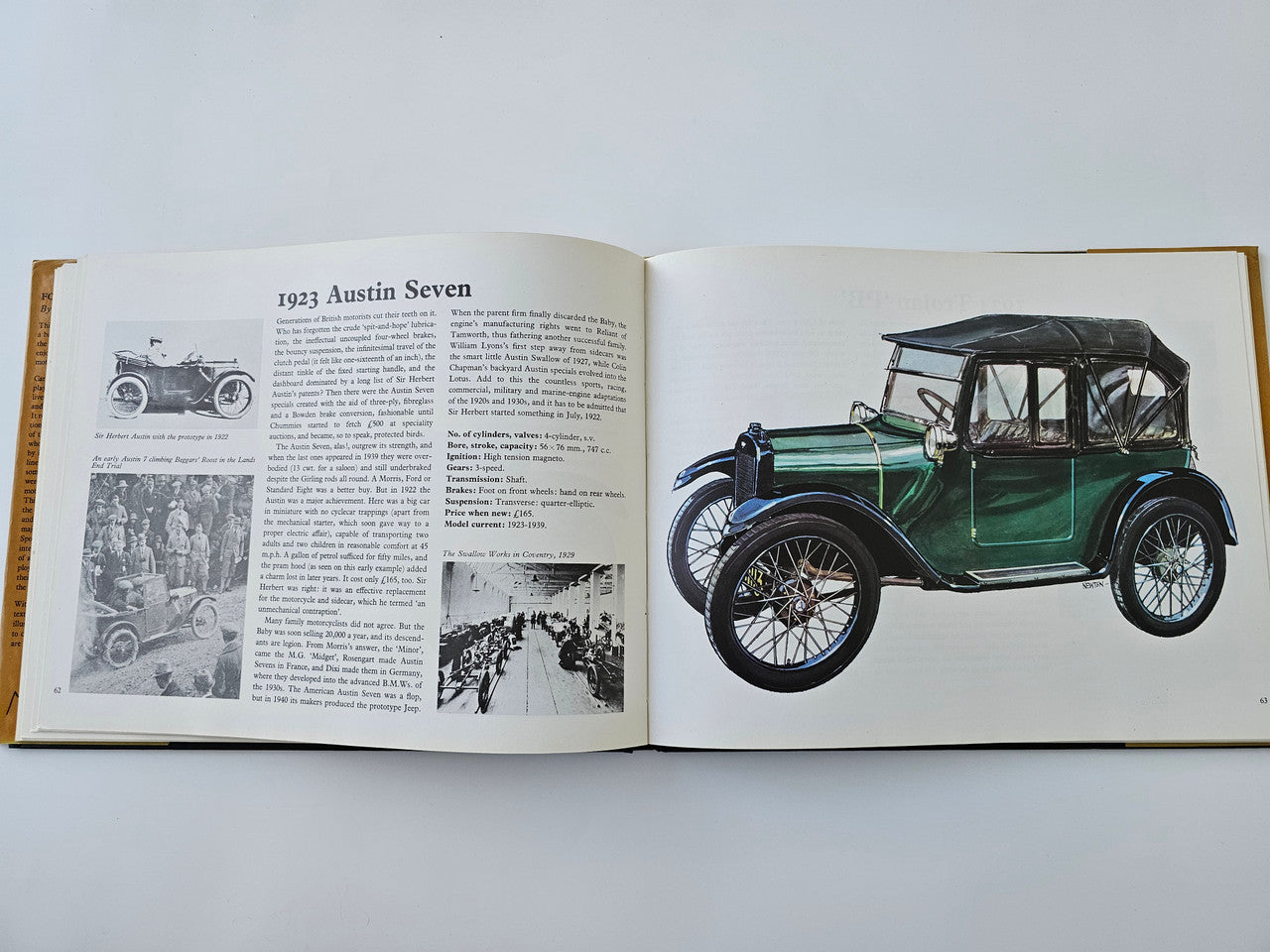 Open vintage automotive history book with Austin Seven text and green car illustration