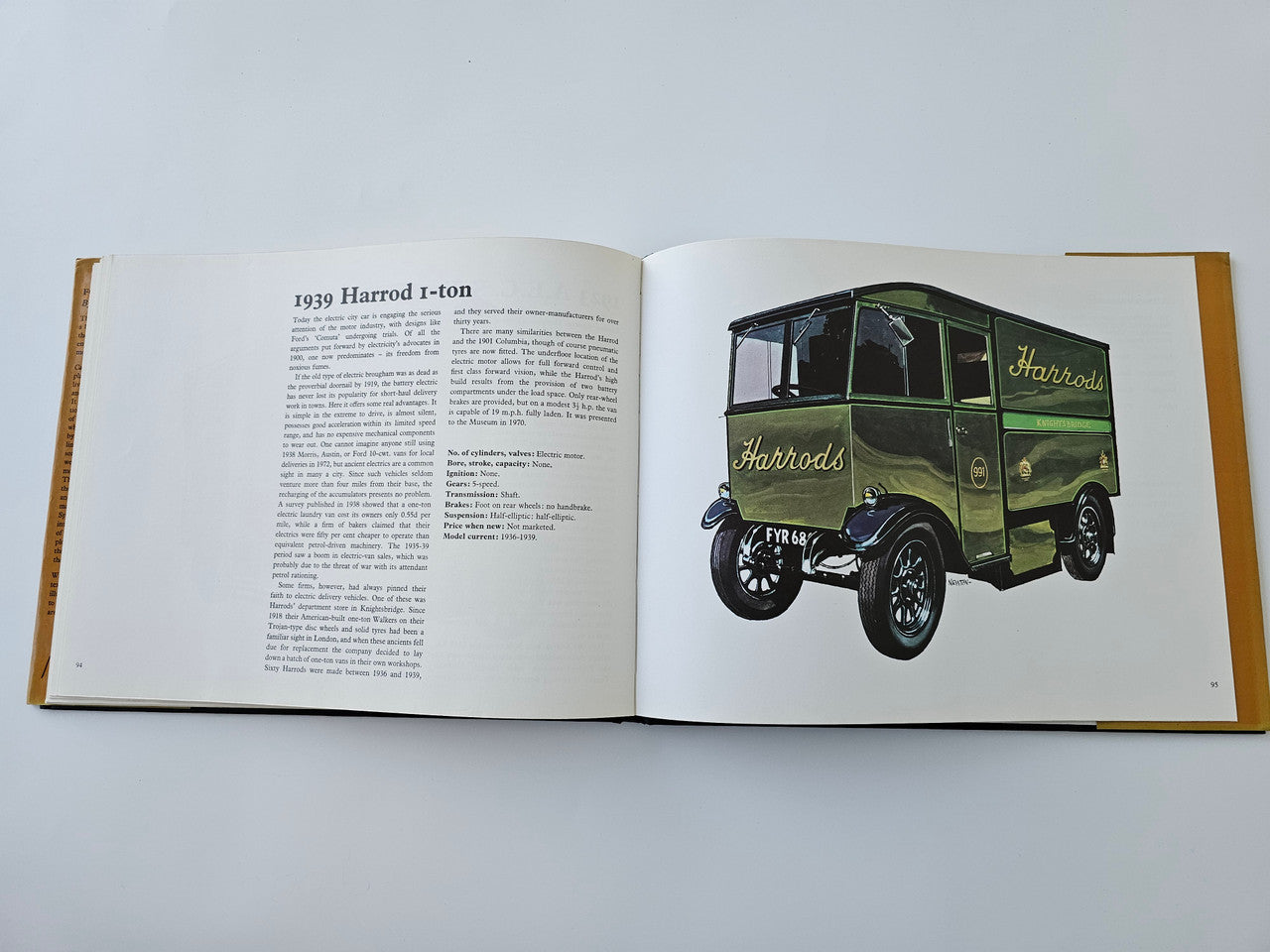 Open vintage motoring history book page with 1939 Harrod 1-ton van illustration