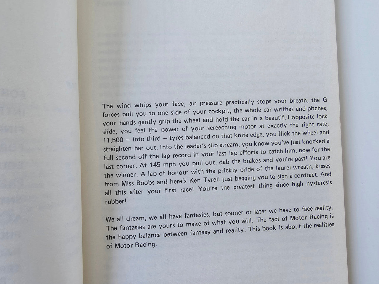 Motor racing guide book page with dense instructional text about wind and traction