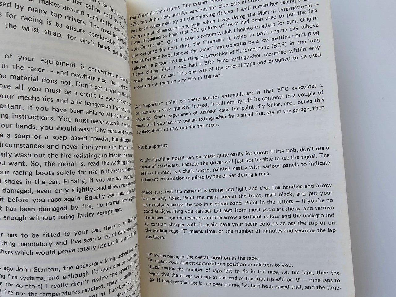 Motor racing guide book page with instructional text on equipment and safety