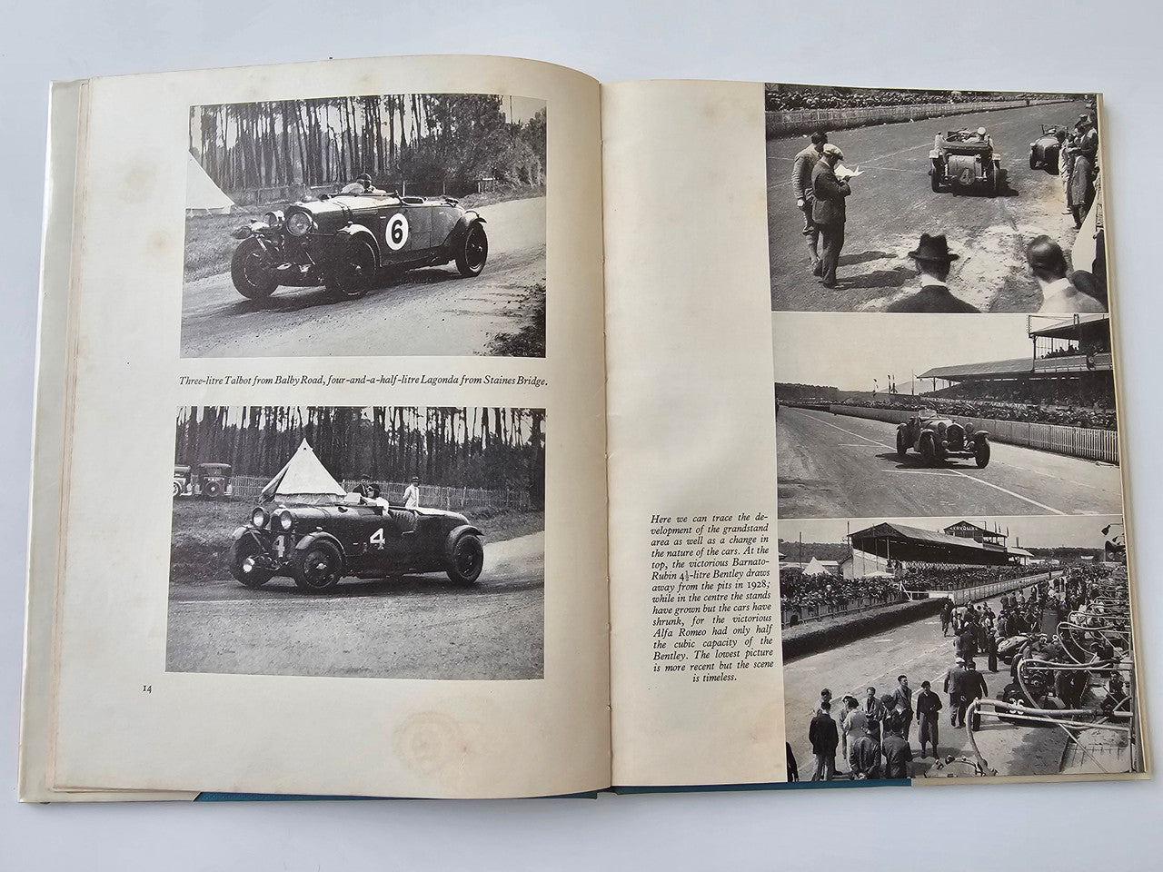 Vintage motoring book open to black-and-white car photos with captions on two pages
