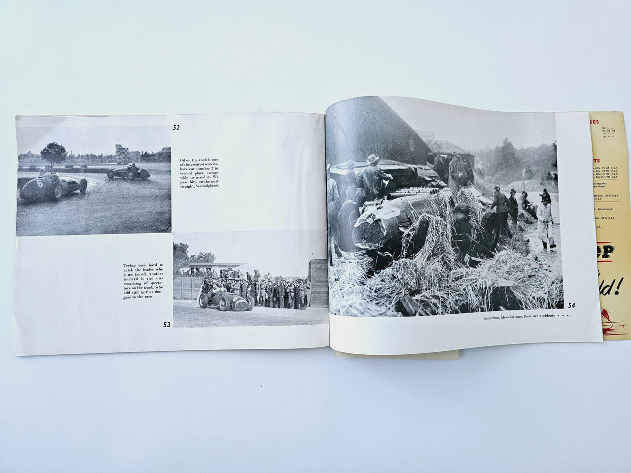 Open book spread with black-and-white photos of racing cars and a crash aftermath scene.