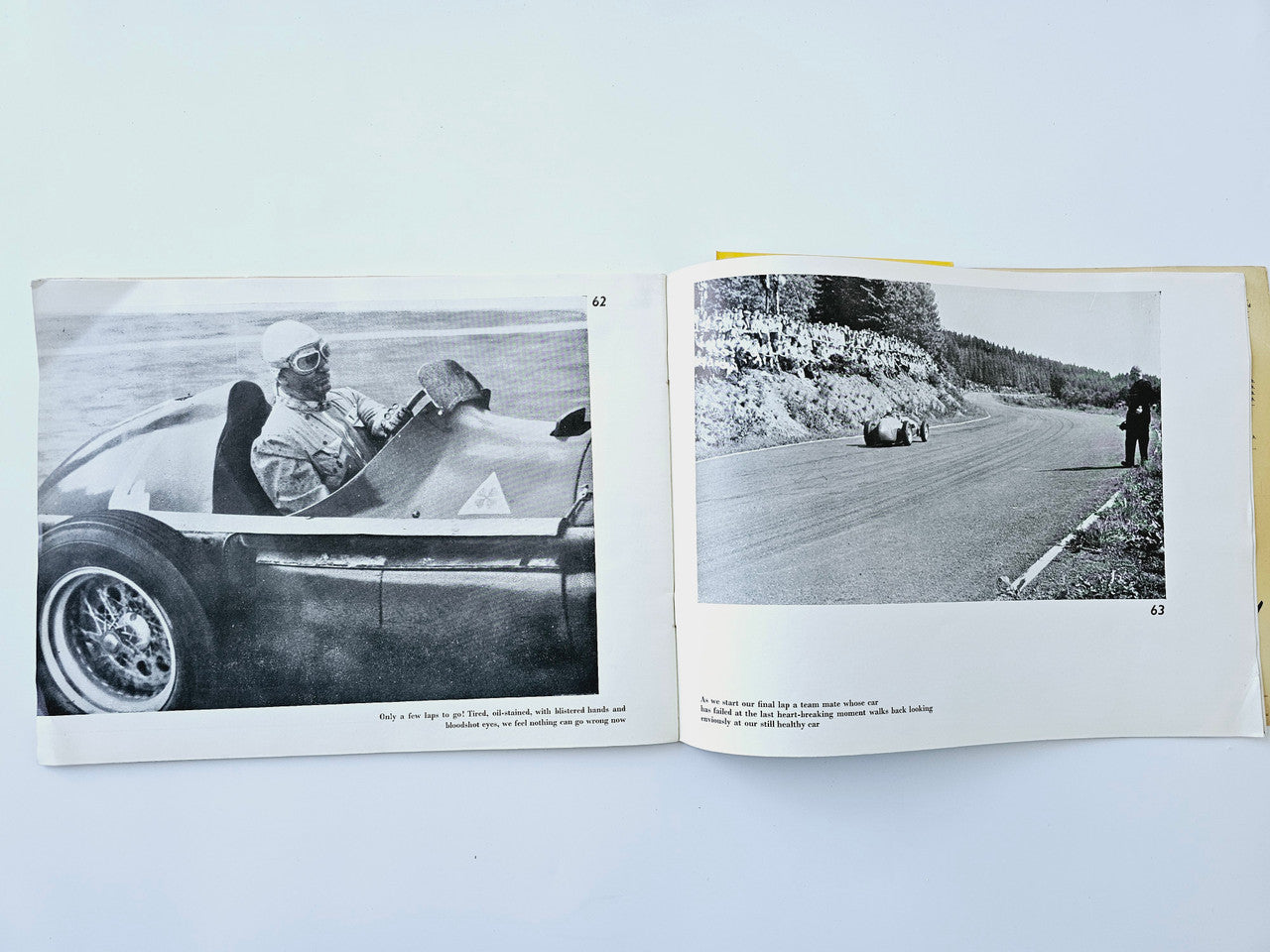 Open book spread with black-and-white photos of a driver close-up and cars on a road.