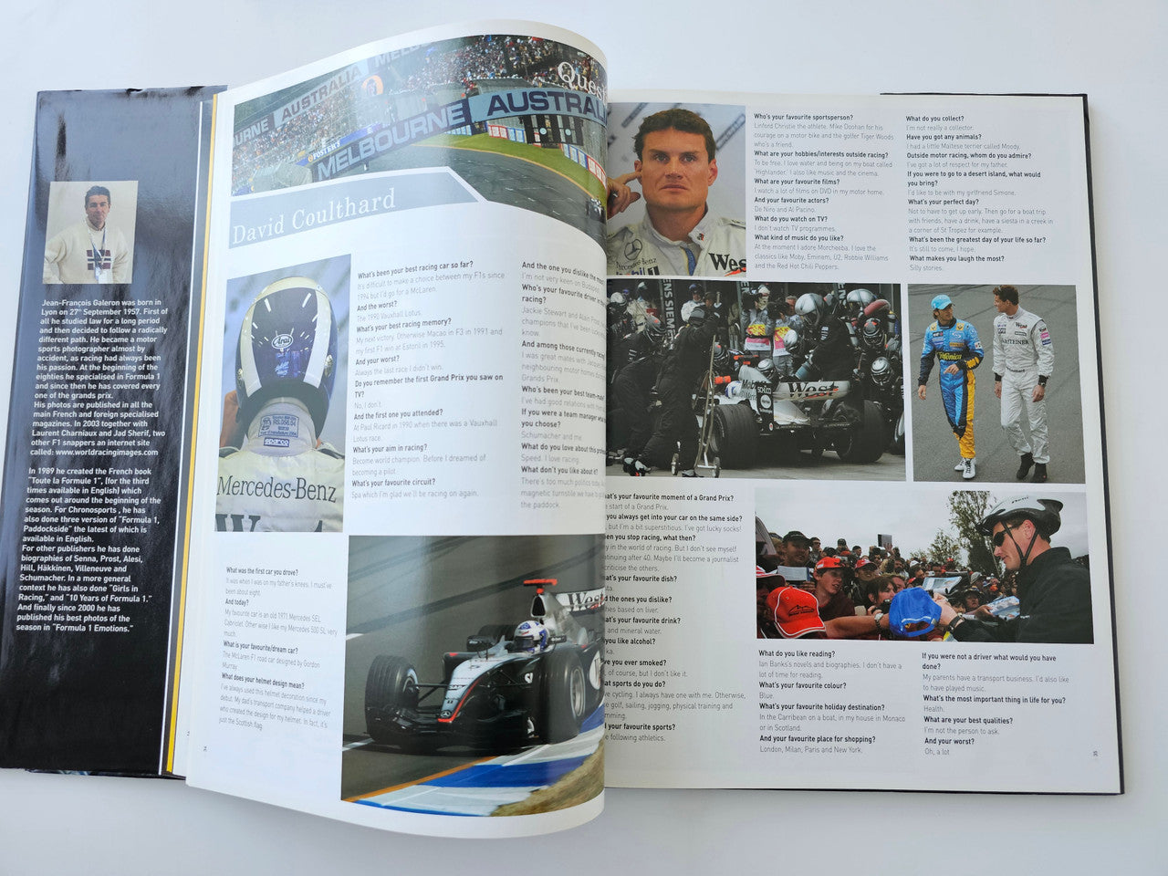 Open guidebook spread with team details, car photos, and driver profile text