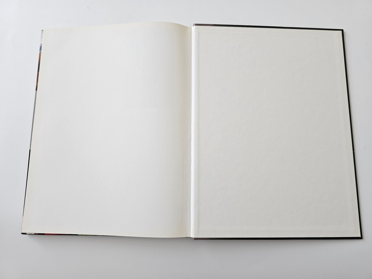 Racing season book opened to blank interior pages