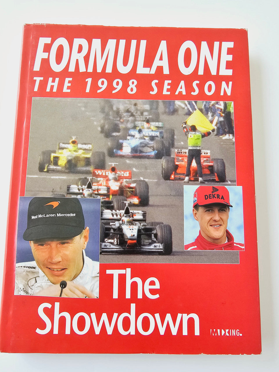 Formula One 1998 Season book cover with drivers, race cars, and red title text