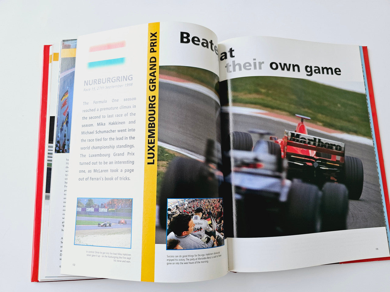Open Formula One book spread with Luxembourg Grand Prix text and track map