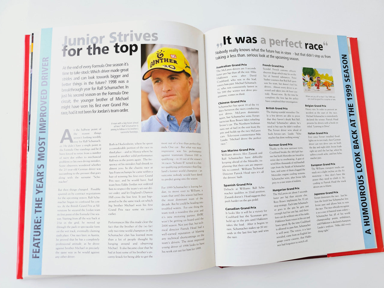 Open Formula One book spread with feature articles and driver portrait on the page