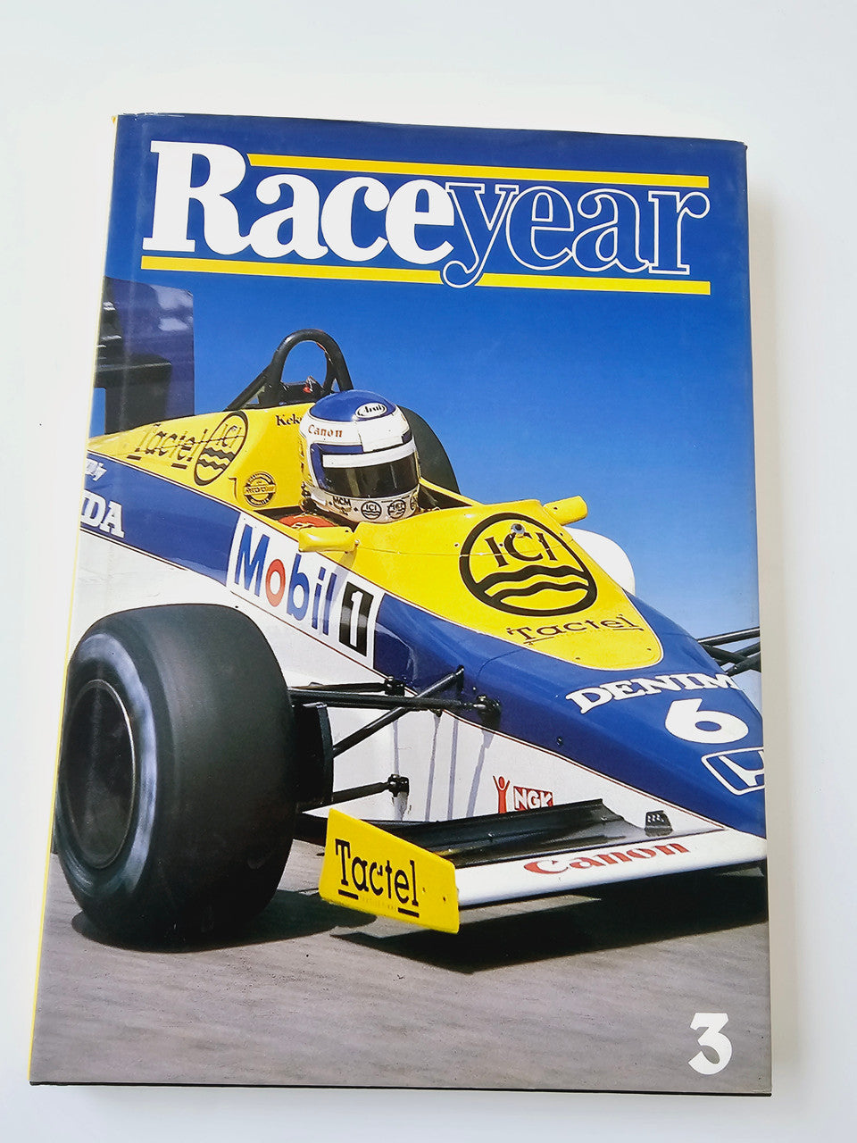 Motoring magazine cover with Raceyear logo and yellow race car, numbered 3