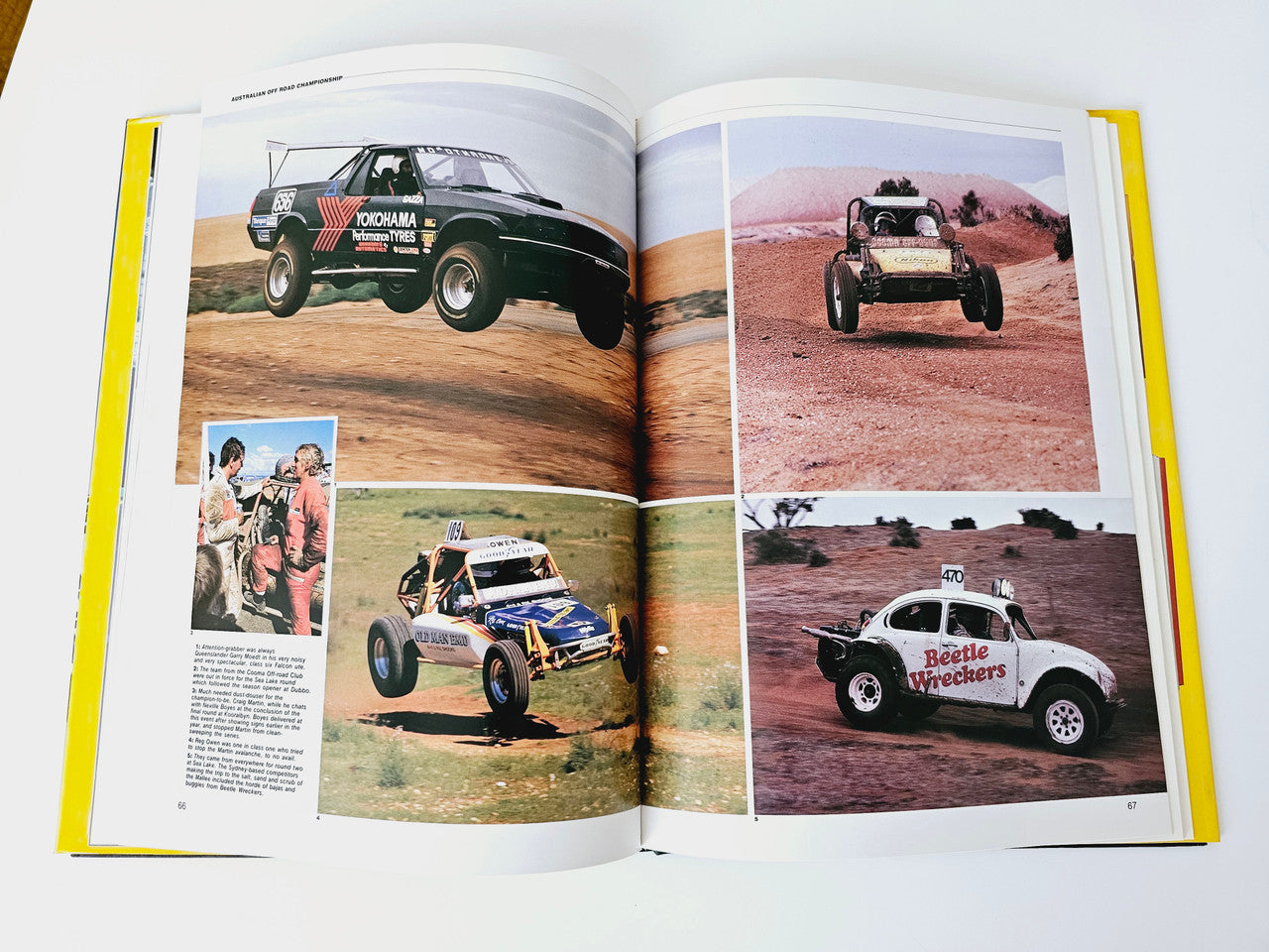 Open motoring magazine spread with off-road and desert race car photos