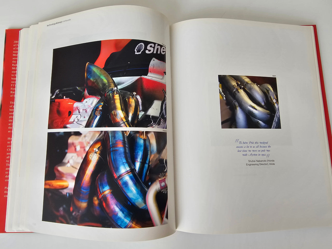 Motorsport photo book open to turbo engine detail photos and a single caption