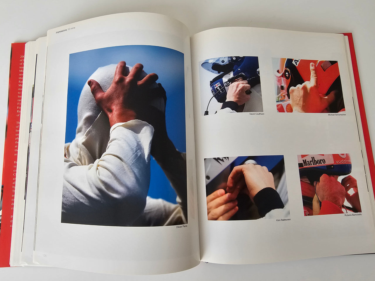 Photo book open spread with driver hands and several small racing photo inserts