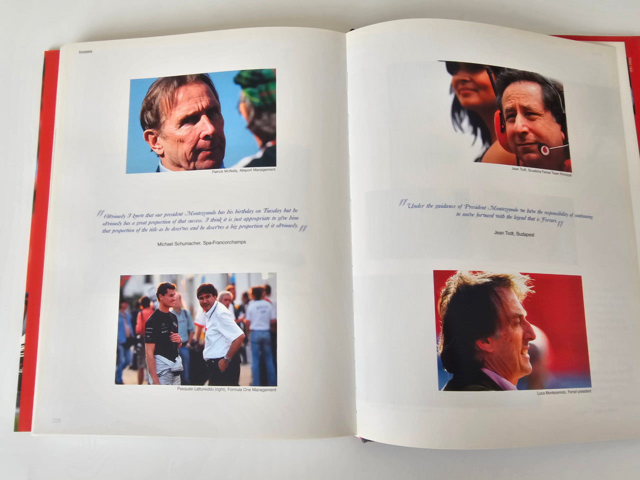 Photo book open spread with racer portraits and a small crowd scene photo