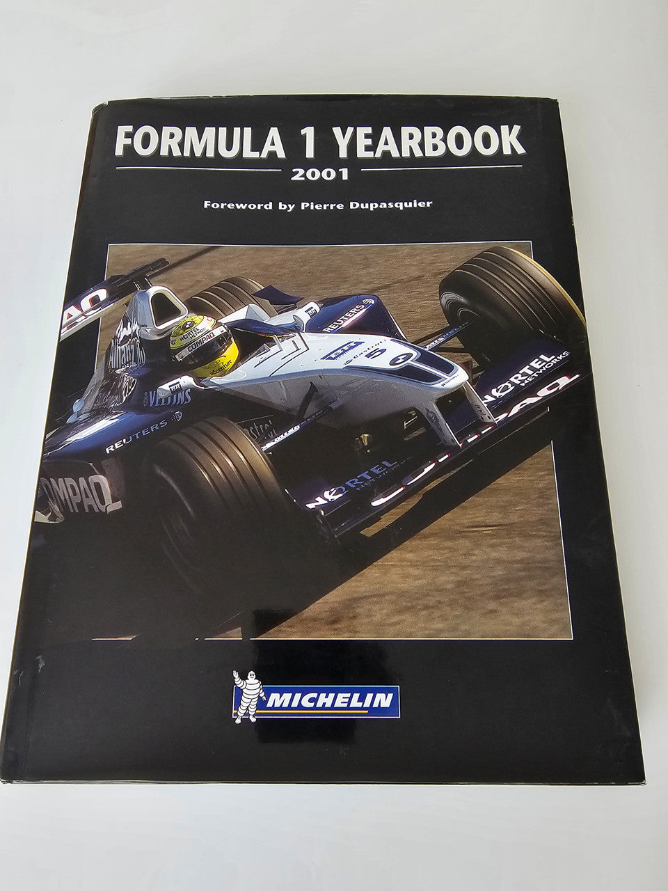 2001 racing yearbook cover with Formula 1 car artwork and Michelin logo