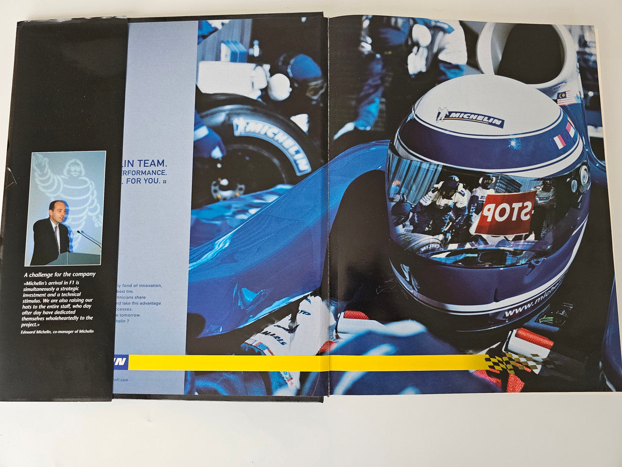 Racing yearbook open spread with helmet photo and interview-style layout pages