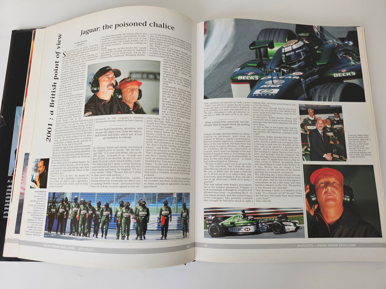 Racing yearbook open feature spread with car action photos and article text