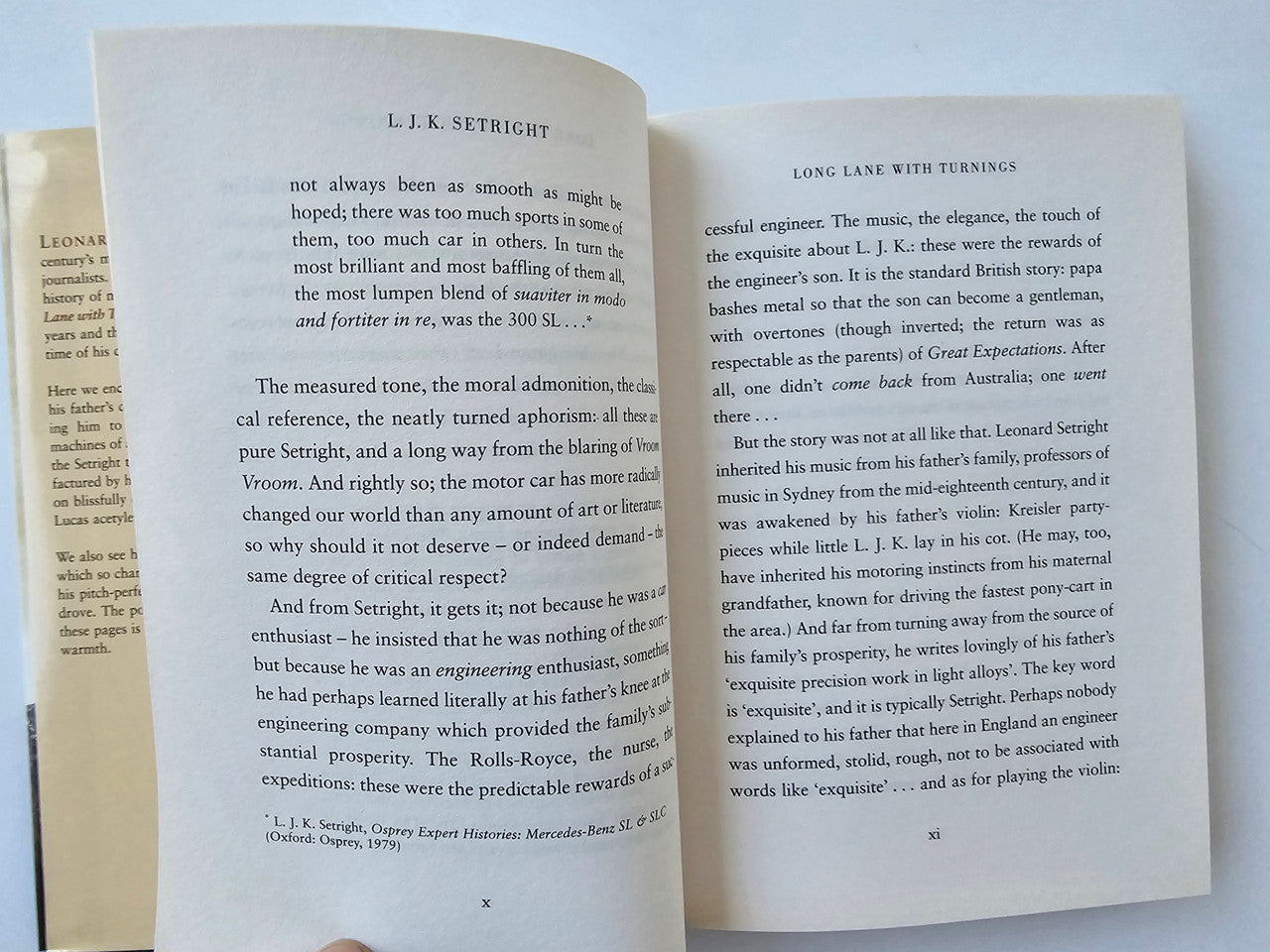 Open book spread with two columns of text and small footer reference lines