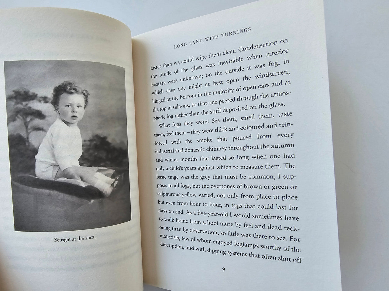 Open book spread with black-and-white portrait on left and text on right