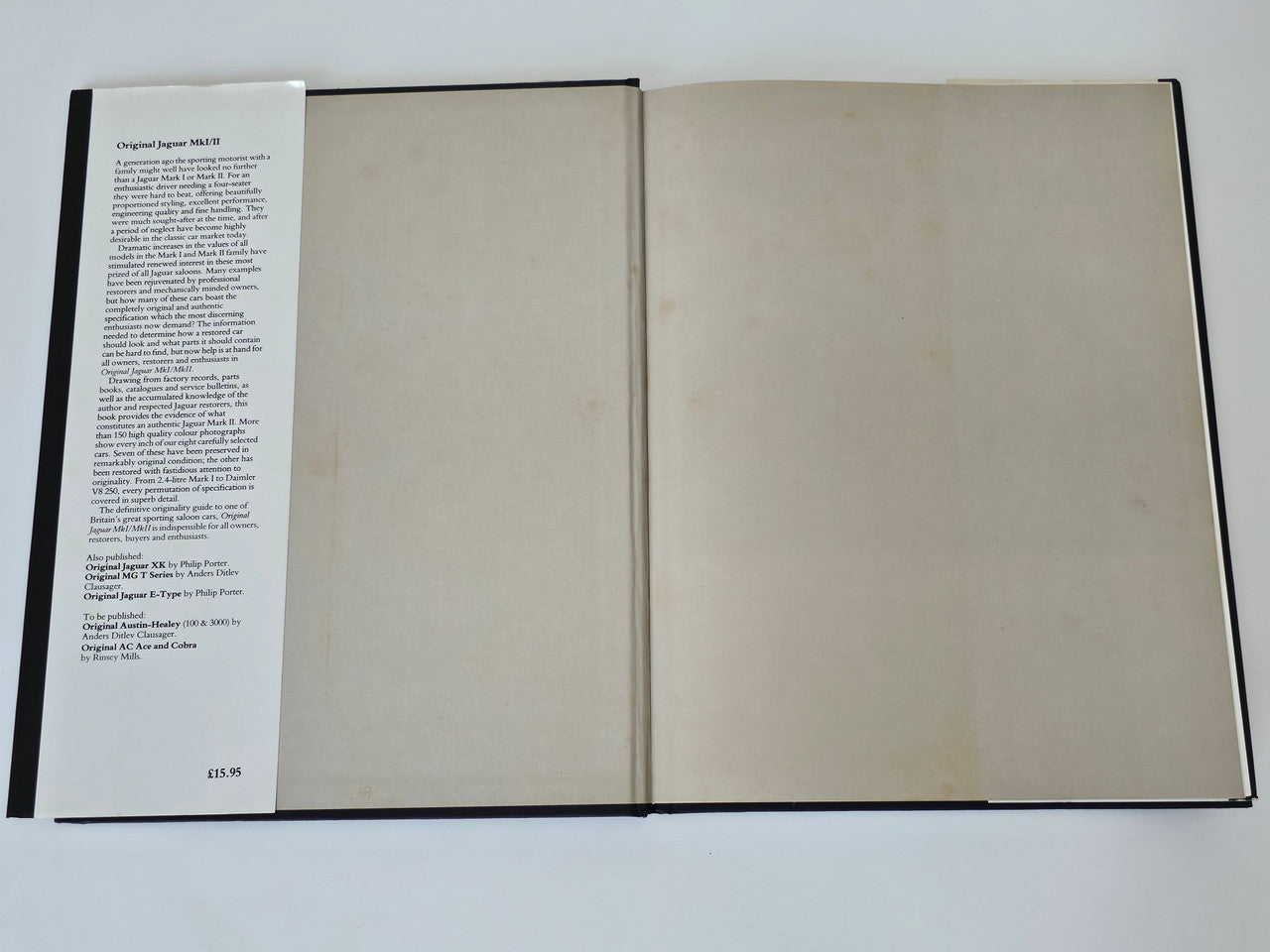 Open Jaguar MkI/MkII restorer’s guide book with printed text page and blank page