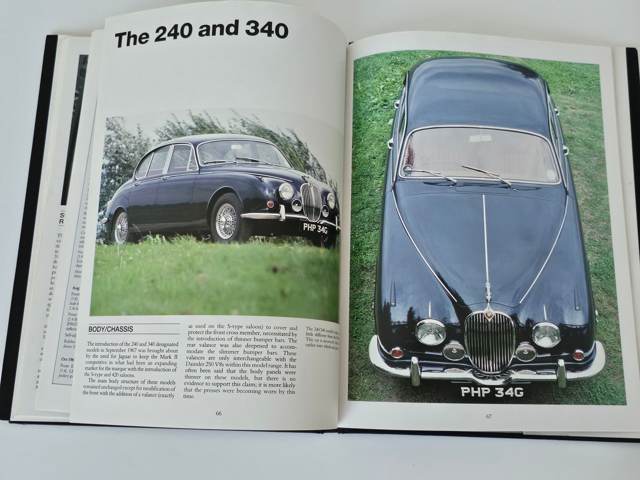 Open Jaguar 240 and 340 guide book pages with car images