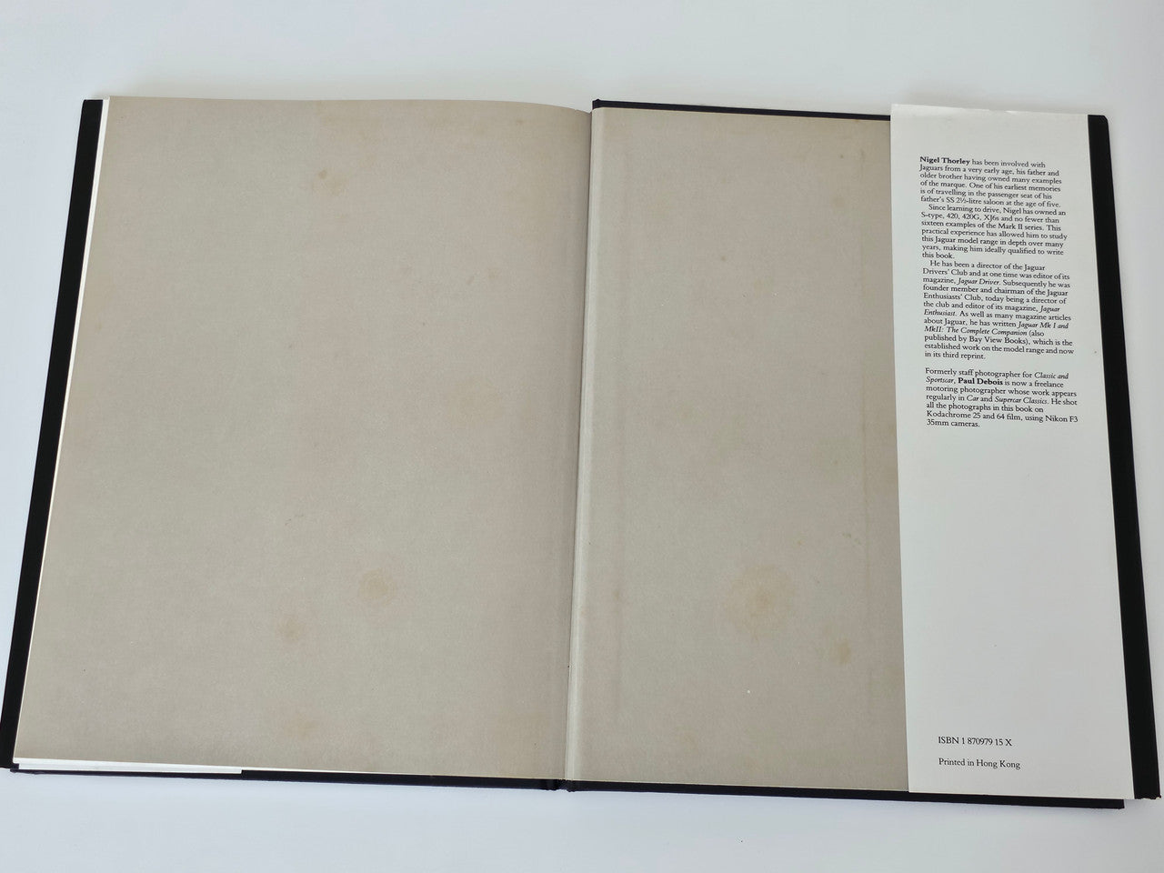 Open Jaguar MkI/MkII restorer’s guide book with blank inside pages