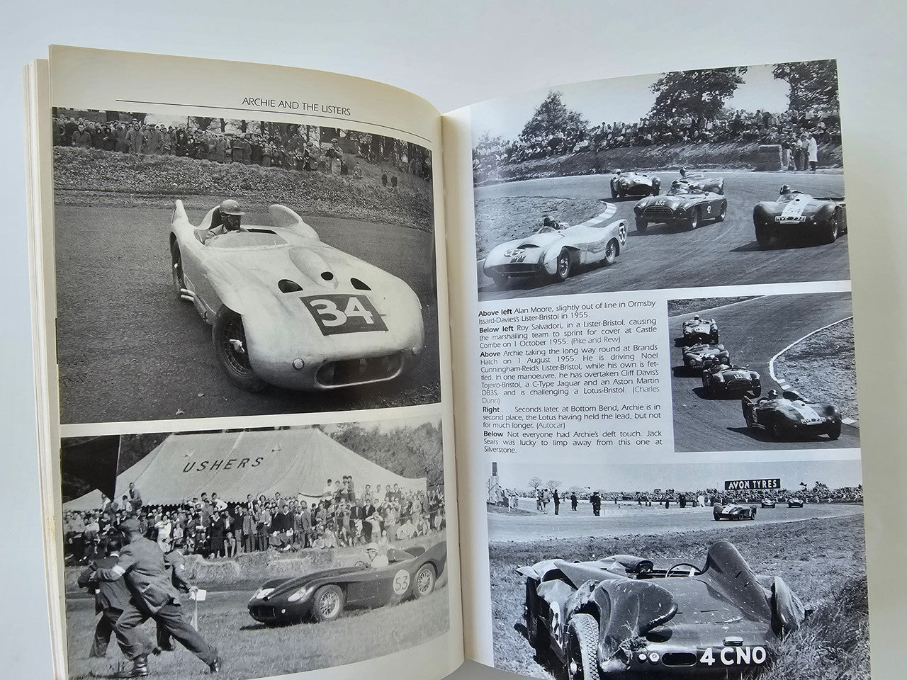 Open book spread with black-and-white racing cars, crowds, and track scenes