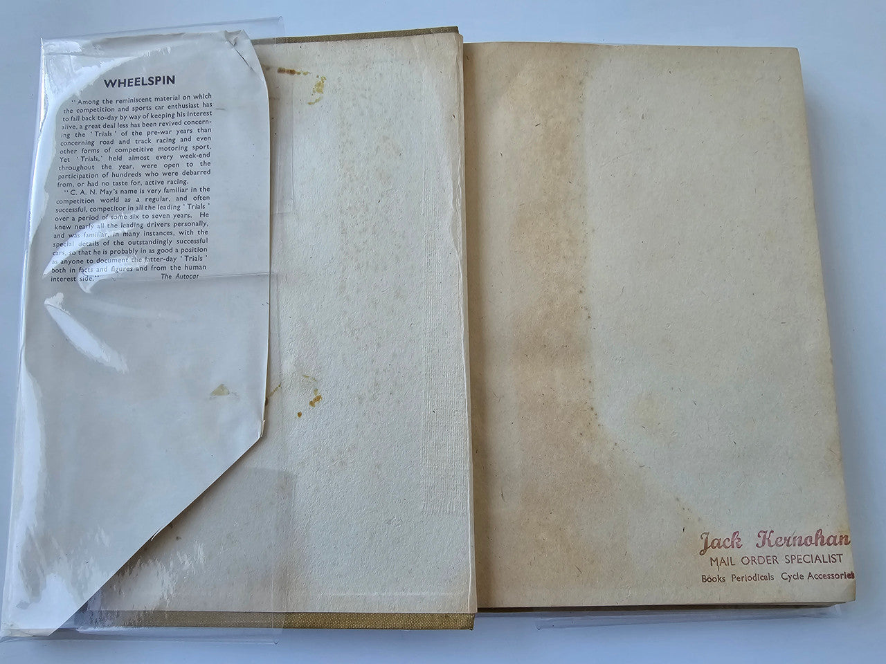 Vintage automotive book with worn slipcase and included letters tucked inside
