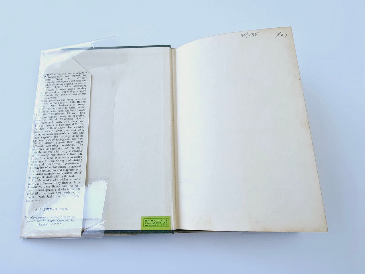 Racing Driver book open to pages with printed text and a mostly blank layout