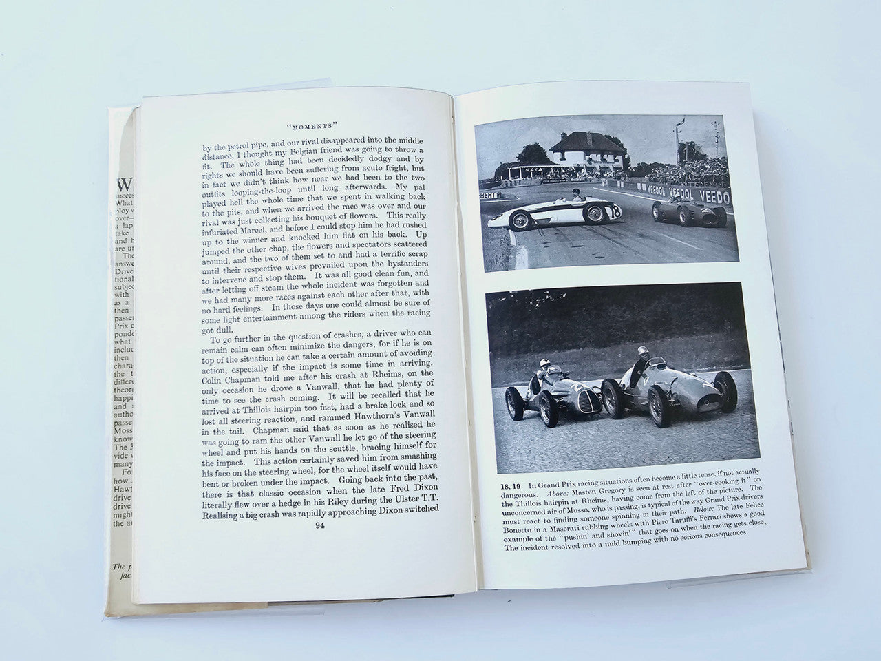Racing Driver book open to article pages with two black-and-white race car photos