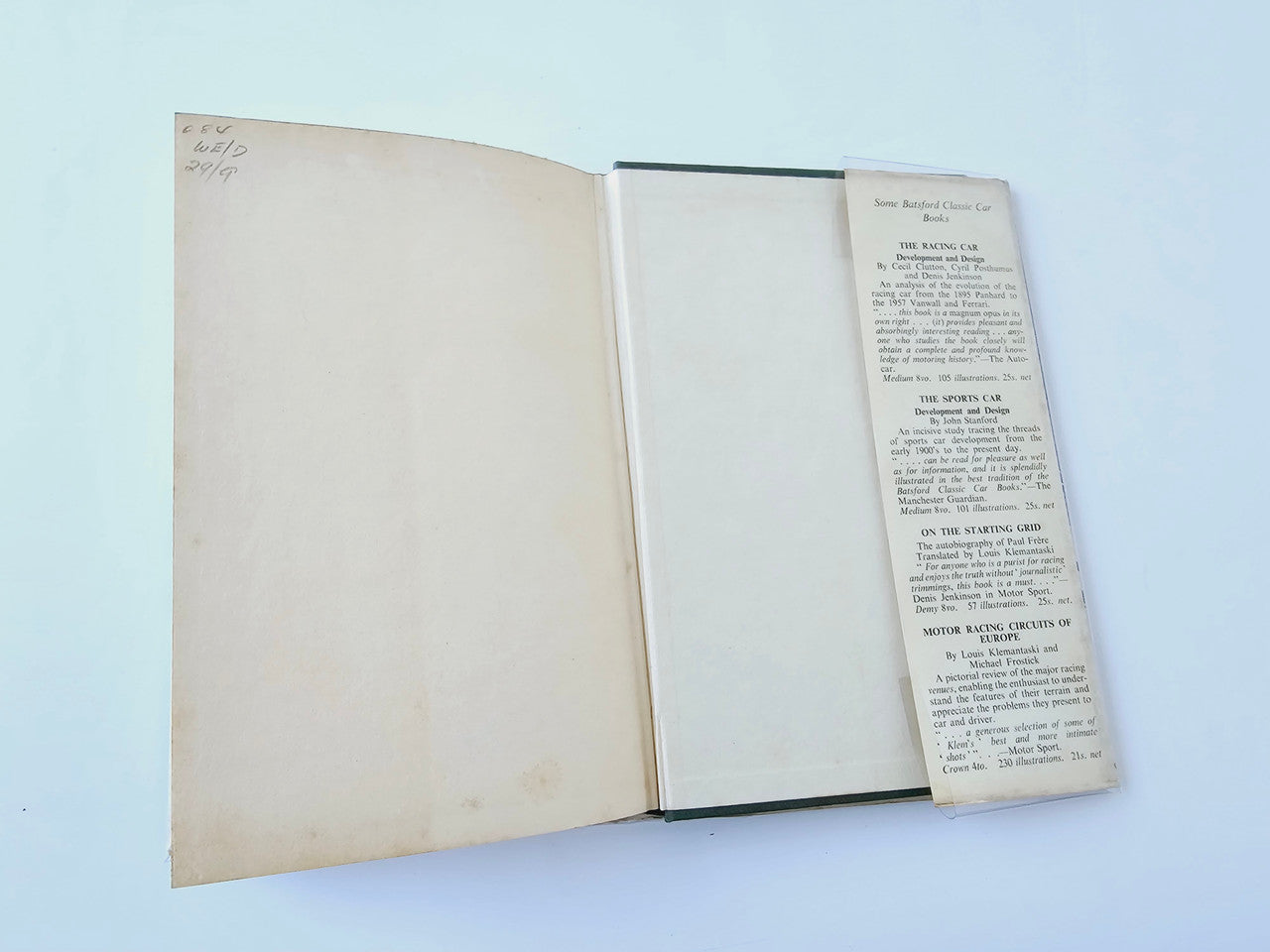 Racing Driver book open with blank pages and a typed block of text on the right