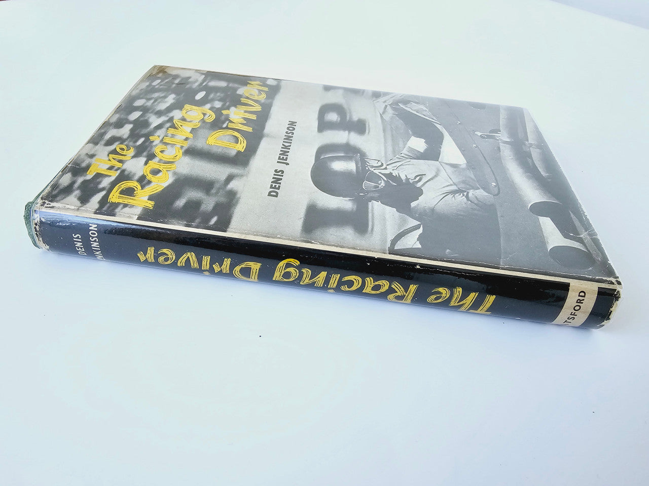 Racing Driver book spine and cover with race car imagery and yellow title lettering