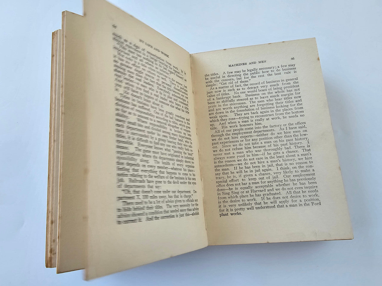 Open book spread with printed paragraphs on off-white pages.
