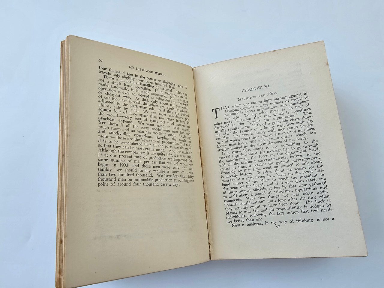 Open book spread with chapter text and headings, off-white paper with slight wear.