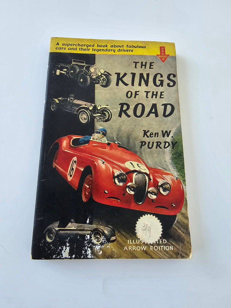 Vintage book cover with red open-top sports car on black background