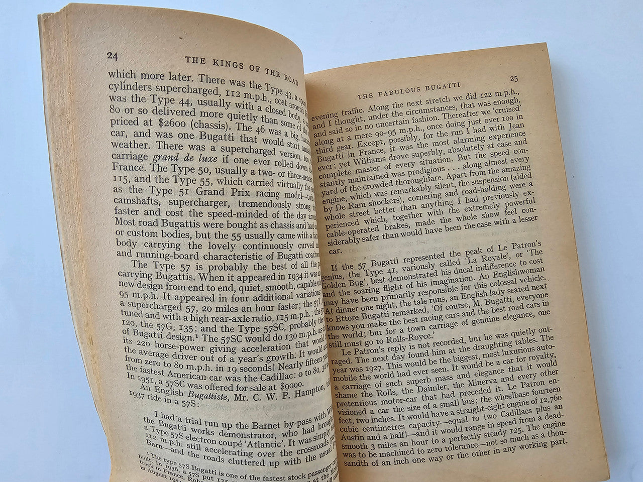 Vintage book open pages with dense black text in two columns