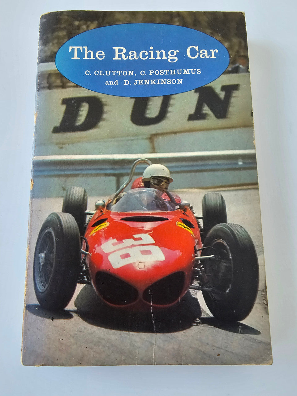 Racing car development book with red race car on blue cover