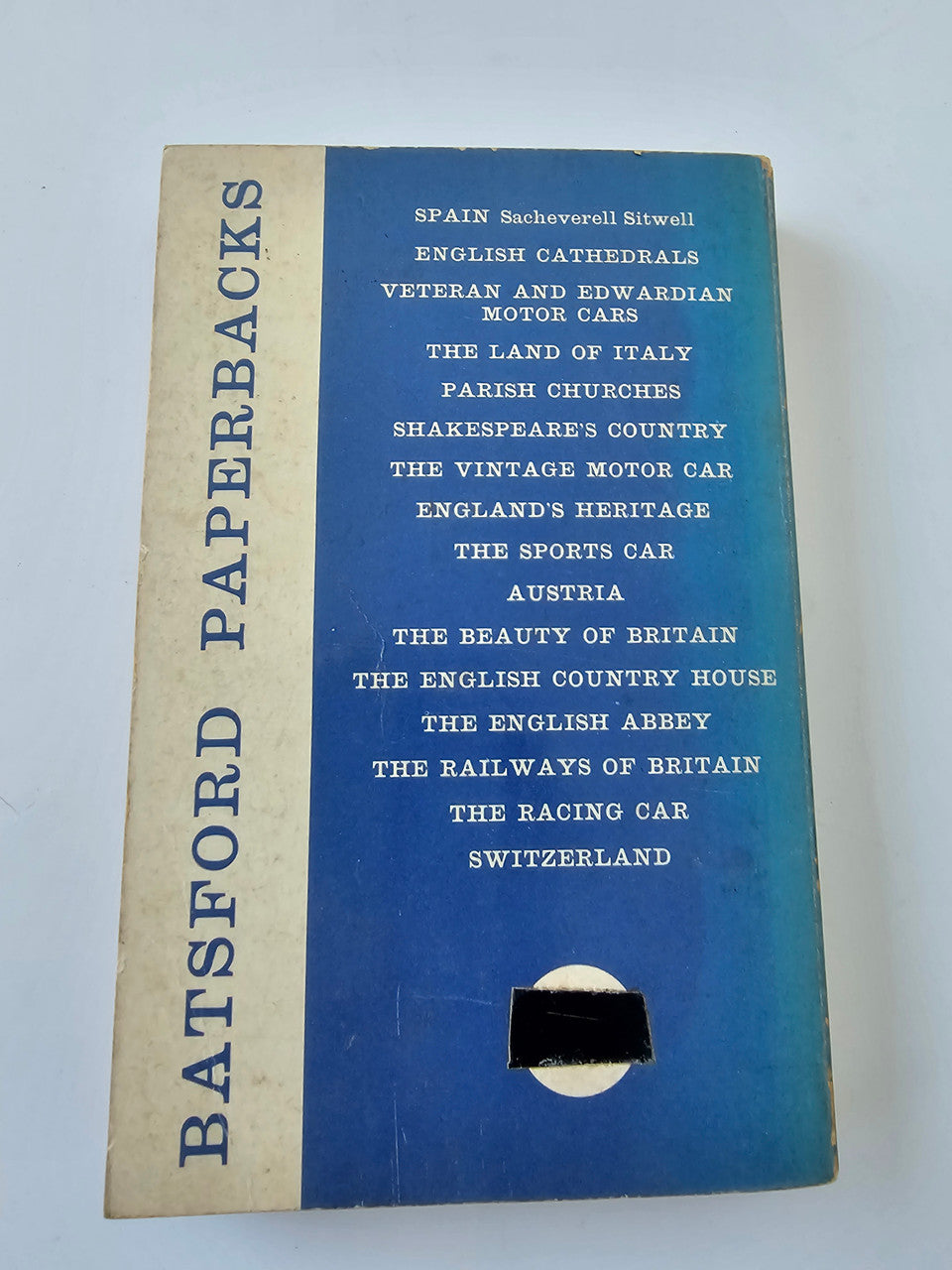 Vintage paperback book with blue cover and vertical spine with PAPERBACK LIBRARY