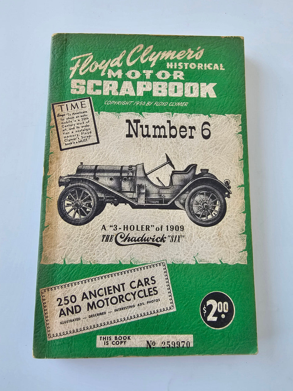 Vintage Floyd Clymer motor scrapbook cover, Number 6, with classic car illustration.