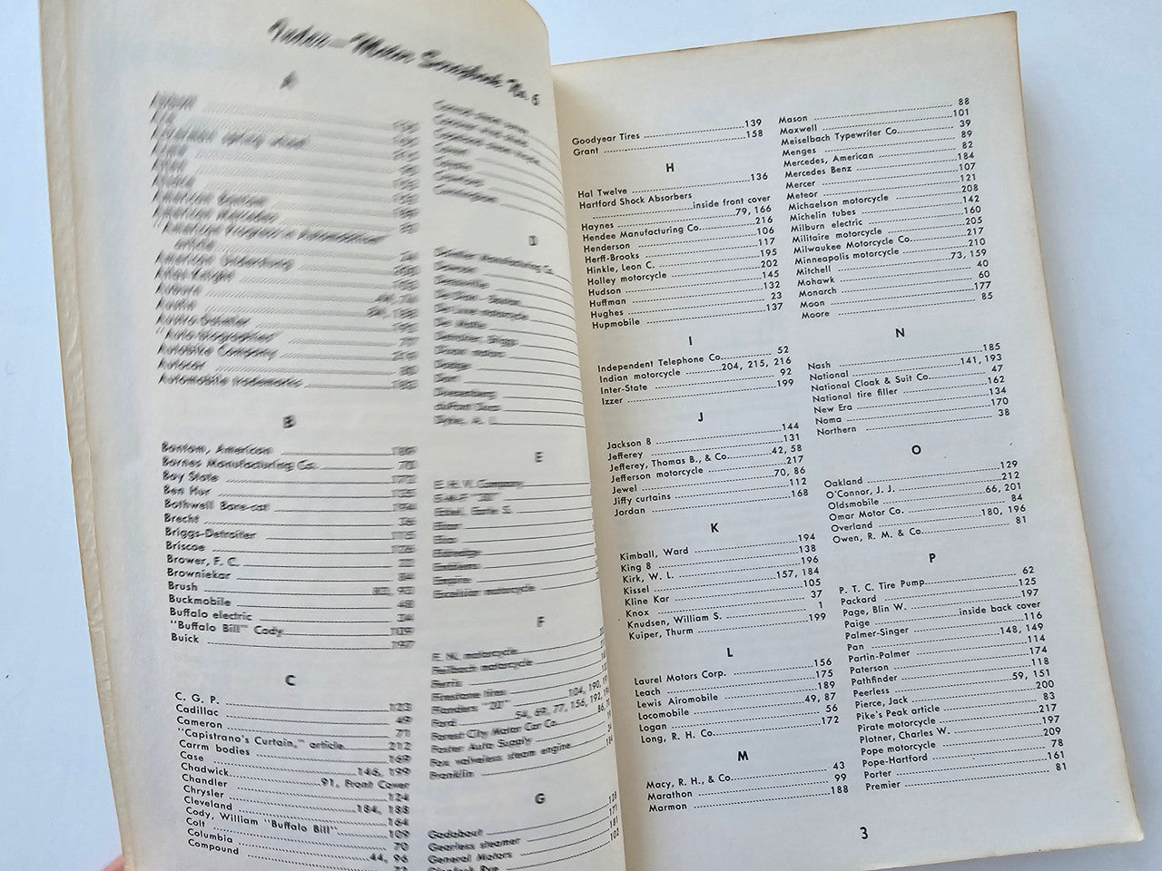 Vintage motor scrapbook spread with dense tables of specifications and notes.