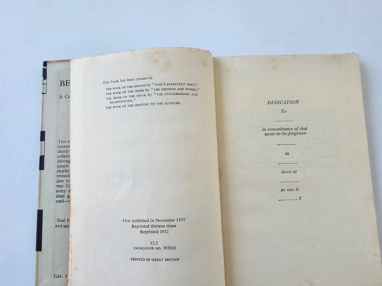 Vintage book open to copyright page and dedication section