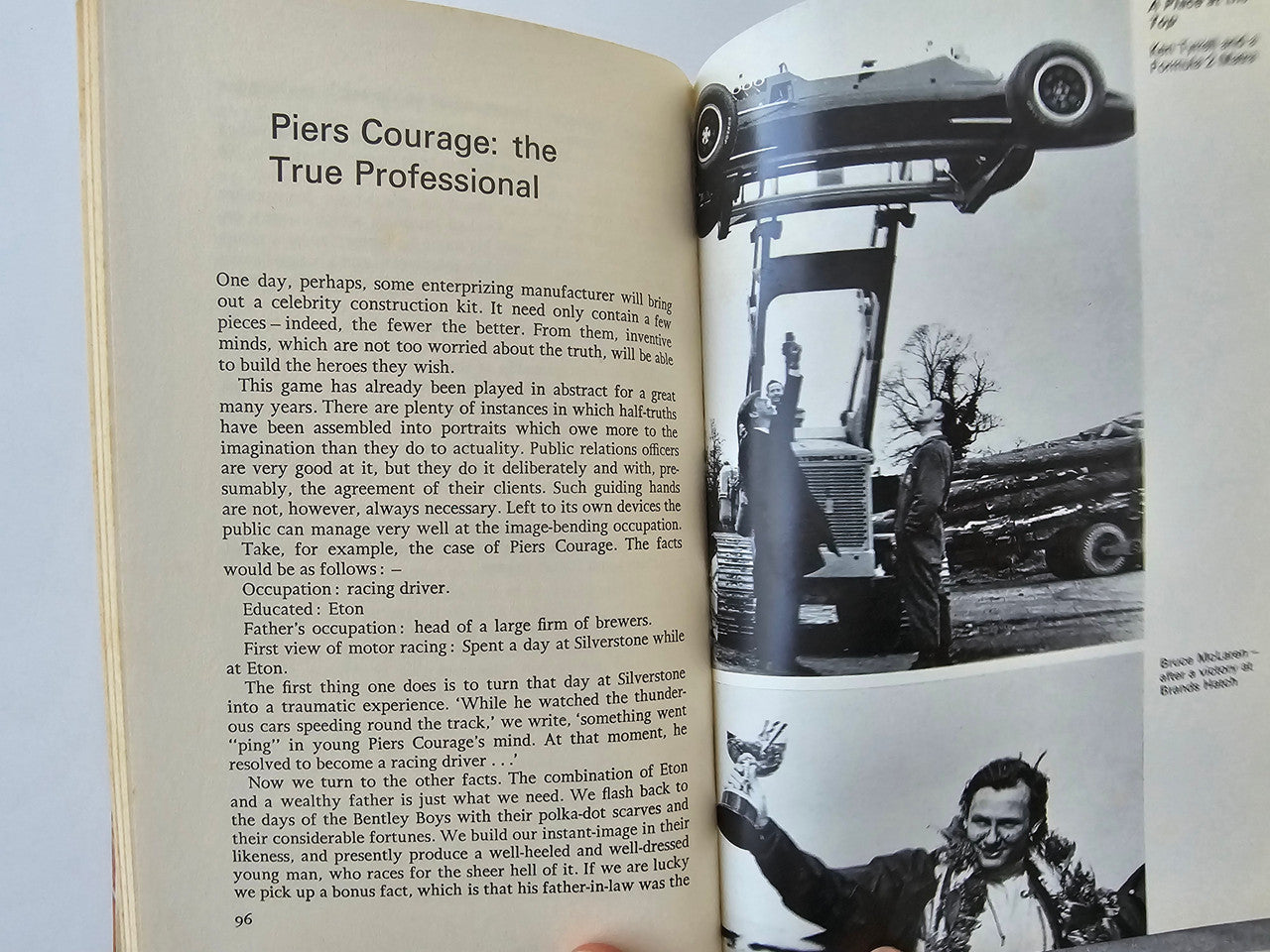 Book open to text page alongside a large black-and-white race photo and portrait