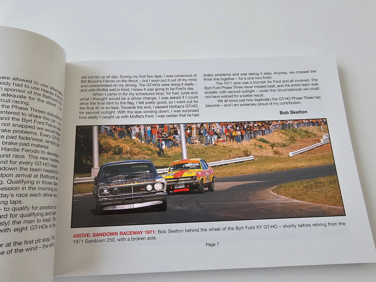 Automotive racing photo book, open pages with two classic Ford Falcon race cars