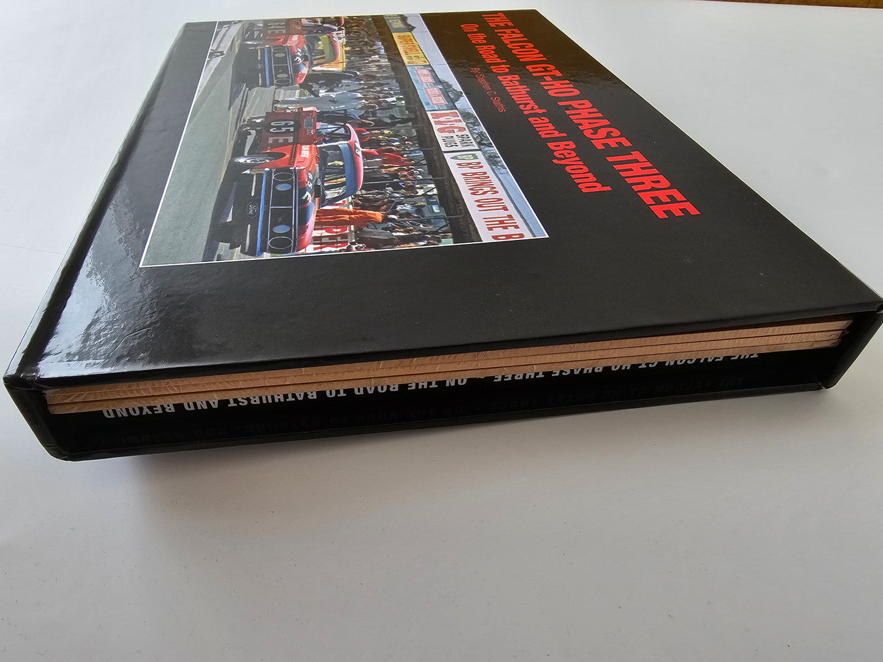 Limited edition automotive book slipcase spine side with black textured finish