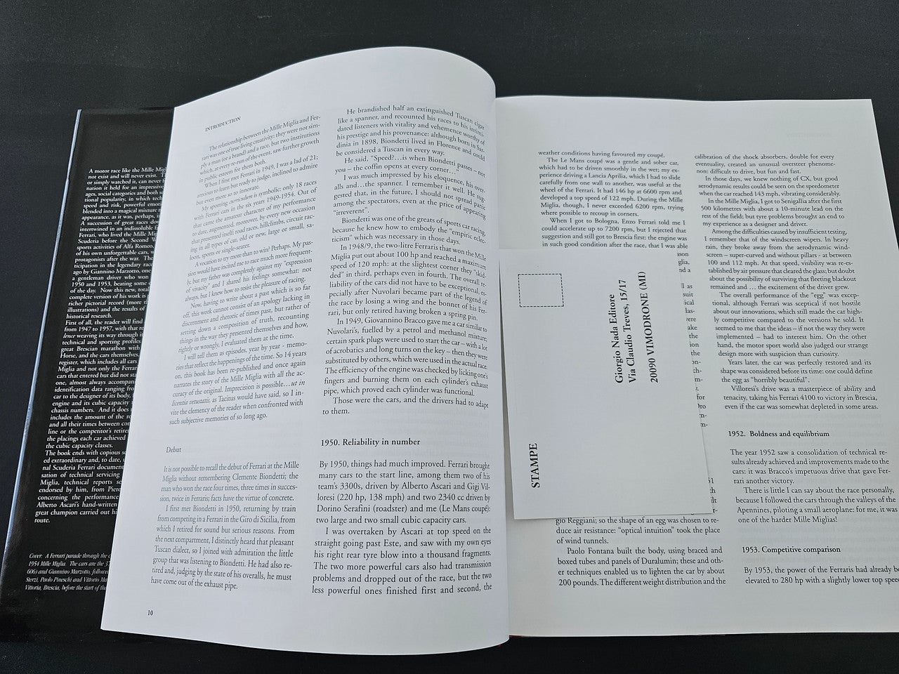 Open book pages with paragraphs of text and a small labeled card on the right