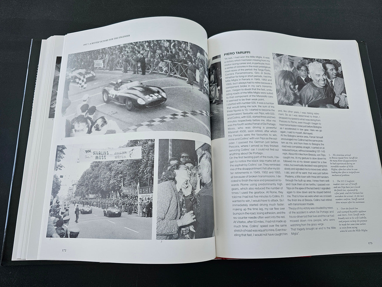 Open hardcover book with black-and-white racing photos and text on both pages